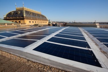 Photovoltaic panel on the roof of a historical building clipart