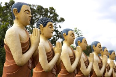 Painted Buddhist Monk statues clipart