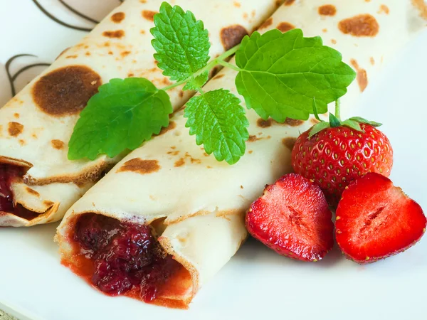 stock image Rolled pancakes with strawberries