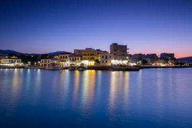 Agios Nikolaos city at night clipart