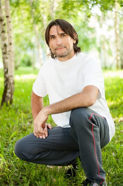 Middle-aged man in a park Royalty Free Stock Images