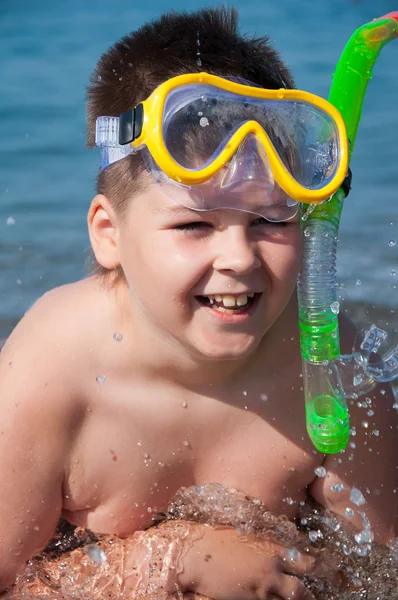 Boy at sea with a mask for snorkeling — Stock Photo, Image
