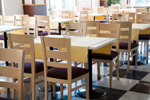 The interior of a cafe with wooden tables — Stock Photo, Image