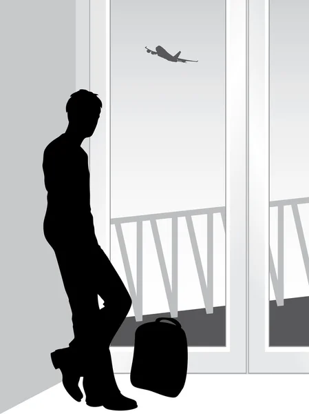 Silhuetten av en resenär i väntan på landa flygplan — Stock vektor