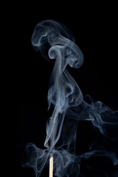 Спичка в дыму Лицензионные Стоковые Фото