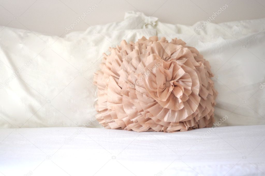 Pastel Pillow on White Bed Sheets