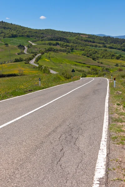Tuscan view with local curve road — Stock Photo, Image