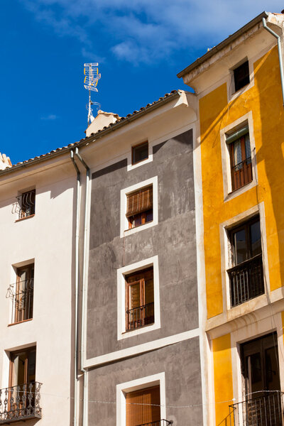 Old color houses facades in Cuenca, central Spain