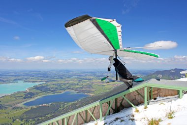 TEGELBERG, GERMANY - MAY 16: Competitor Oleg Matvieev from Ukraine of the King Ludwig Championship hang gliding competitions takes part on May 16, 2012 in Tegelberg, Germany clipart