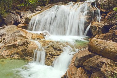 The waterfall in the canyon 