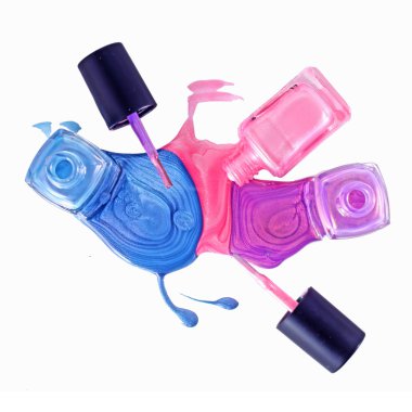 Bottles with spilled nail polish over white background clipart