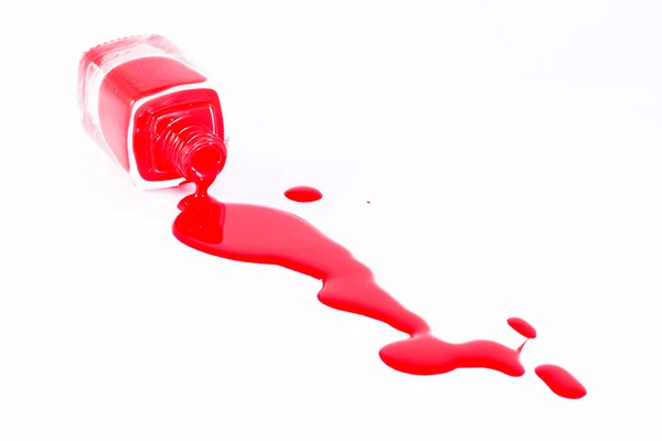 Esmalte de uñas rojo y botella en blanco — Foto de Stock