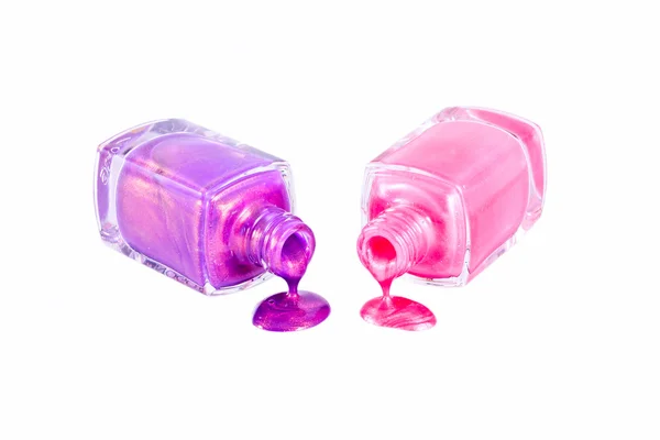 Esmalte de unhas rosa e violeta isolado — Fotografia de Stock