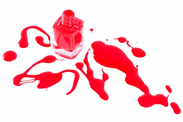 Red nail polish and bottle on white — Stock Photo, Image
