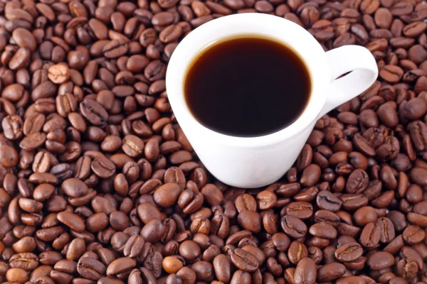 Granos de café y taza — Foto de Stock