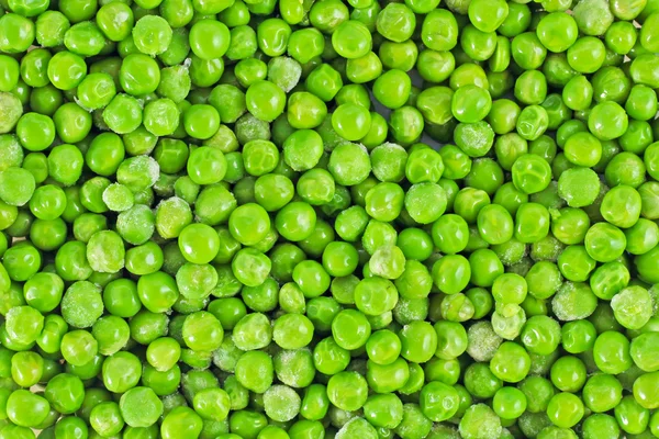 Cáscara fresca madura guisantes verdes fondo — Foto de Stock