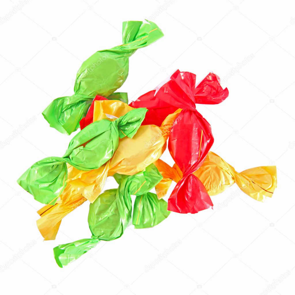Candy in colored wrapper isolated on white