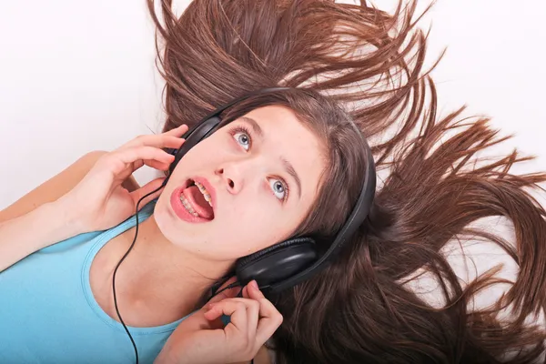 stock image Nice teen girl listening to music with headphones