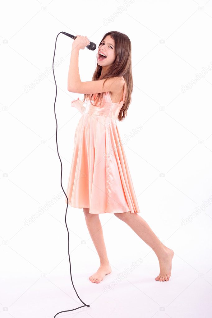 Nice teen girl with microphone, singing