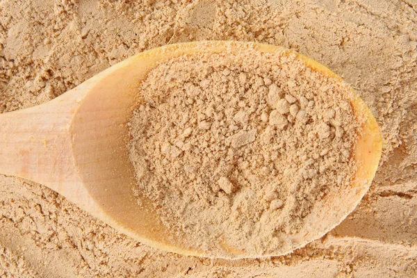 Ginger powder with the wooden spoon background — Stock Photo, Image