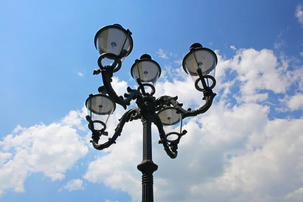 stock image Electric street light pole over blue sky with clouds