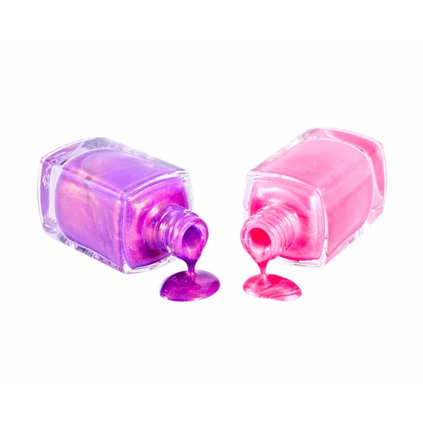 Esmalte de unhas rosa e violeta isolado — Fotografia de Stock