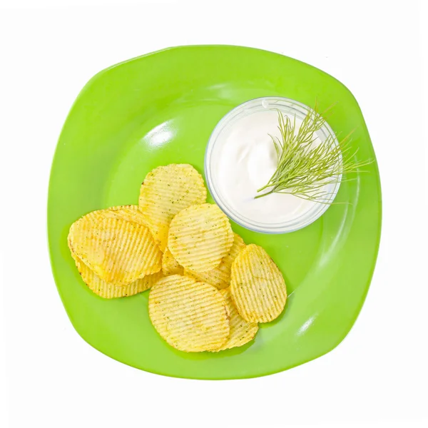 Crisp baked potato wedge in a bowl of sour cream — Stock Photo, Image