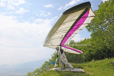GEMONA, ITALY- JULY 2012: Julia Burlachenko competes in the Italian Open-2012 hang gliding competitions at Gemona on July 17, 2012 near Gemona, Italy clipart