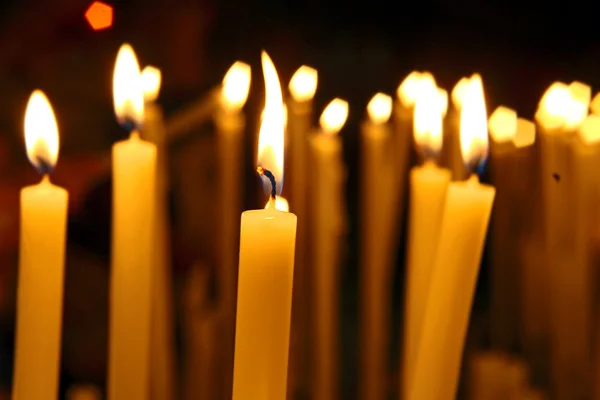 Close up view of the candles cutting through the darkness. — Stock Photo, Image