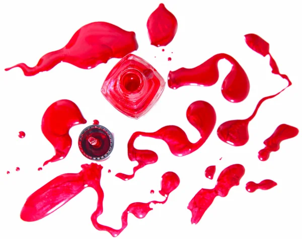 Κόκκινο βερνίκι νυχιών μπουκάλι με splatters που απομονώνονται σε λευκό φόντο — Φωτογραφία Αρχείου