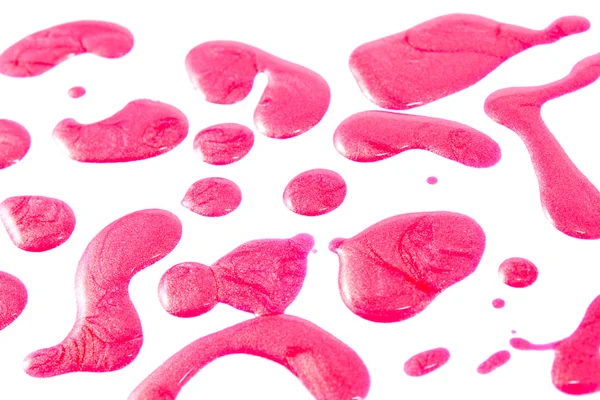 Różowy lakier do paznokci butelka z rozpryskami izolowane na białym tle — Zdjęcie stockowe