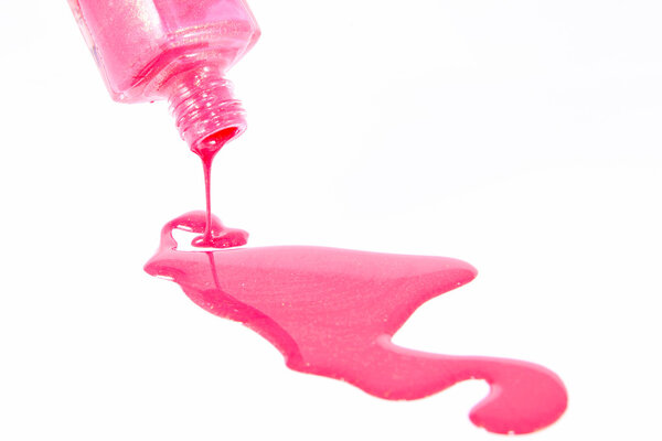 Bottle of the pink nail polish isolated