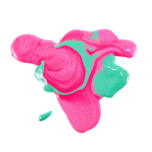 Närbild av utspillt färgglada nagellack - rosa och grön — Stockfoto
