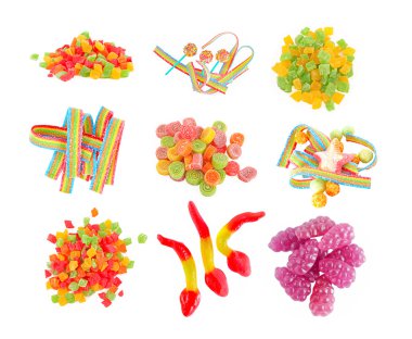 Mixed colorful fruit candies close up on the white background clipart