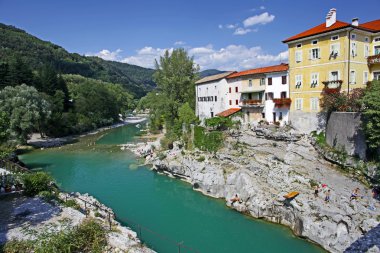 Beautiful rive Soca and ancient buildings in small town Kanal, Slovenia clipart