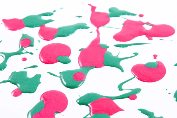 こぼされたカラフルなマニキュア - ピンクとライト グリーンのクローズ アップ — ストック写真