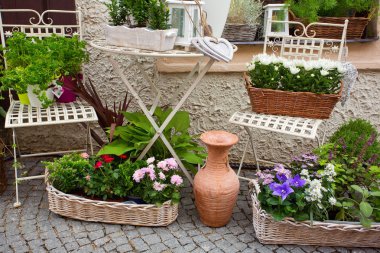 Herb leaf and flowers selection in a rustic wooden basket clipart