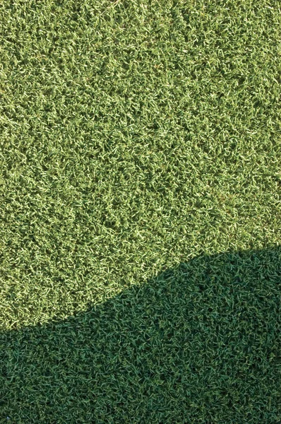 Gazon artificiel faux gazon synthétique pelouse champ macro gros plan wi — Photo