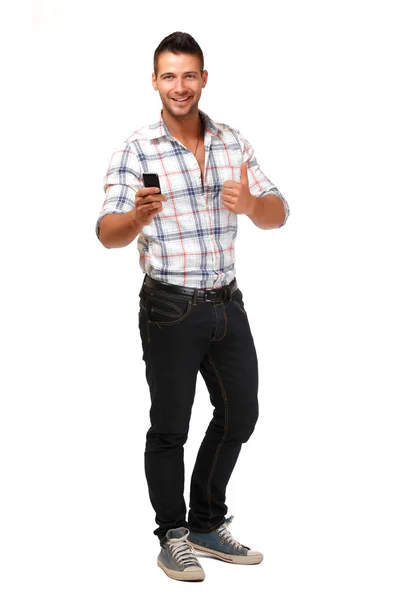 Glad ung man poserar med mobiltelefon — Stockfoto