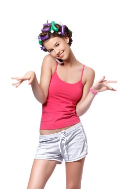 Teenager making a call and drying her nails portrait clipart