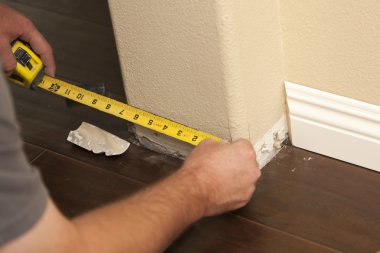 Measuring for New Baseboard with Bull Nose Corners and New Lamin clipart