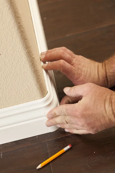 Contractor Installing New Baseboard with Bull Nose Corners and N — Stock Photo, Image