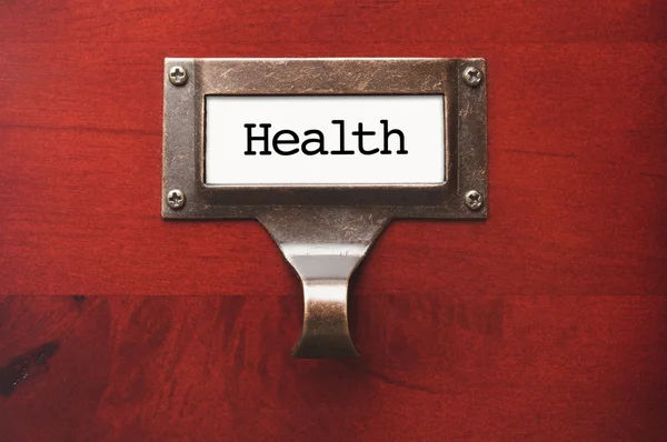 Lustrous Wooden Cabinet with Health File Label — Stock Photo, Image