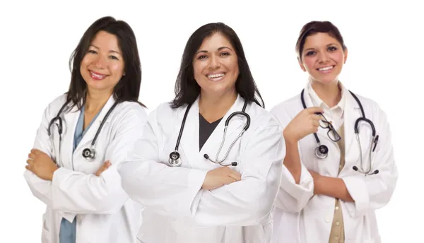 Three Hispanic Female Doctors or Nurses on White Royalty Free Stock Photos