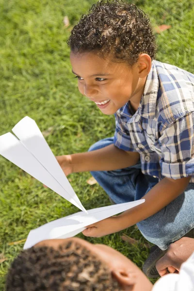 Mixed Race Father and Son Playing with Paper Airplanes — Stock Photo, Image