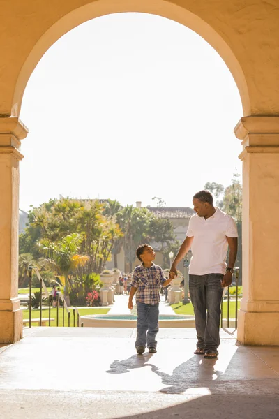 stock image Mixed Race Father and Son Walking in the Park