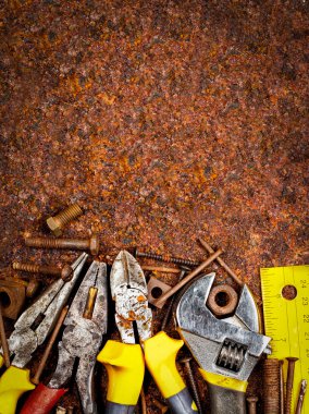 Tools on a rusty background clipart