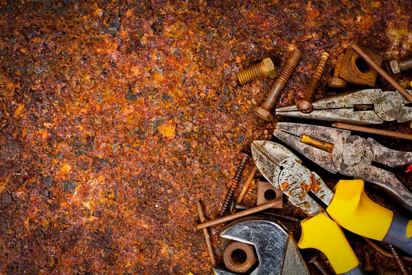 Tools on a rusty background — Stock Photo, Image