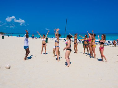 Tourists taking dance lessons in Cuba clipart