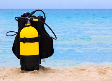 Underwater diving equipment on a cuban beach clipart